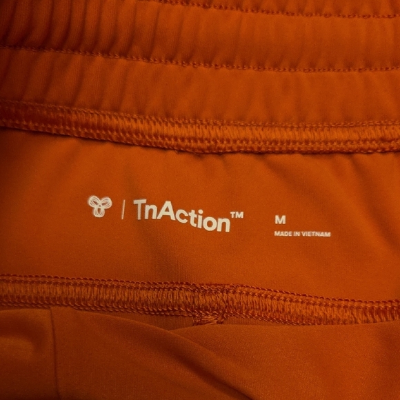 TNA Action Slick Warm Up 3" Short Zipper Pocket Size M Burnt Apricot - Picture 4 of 11